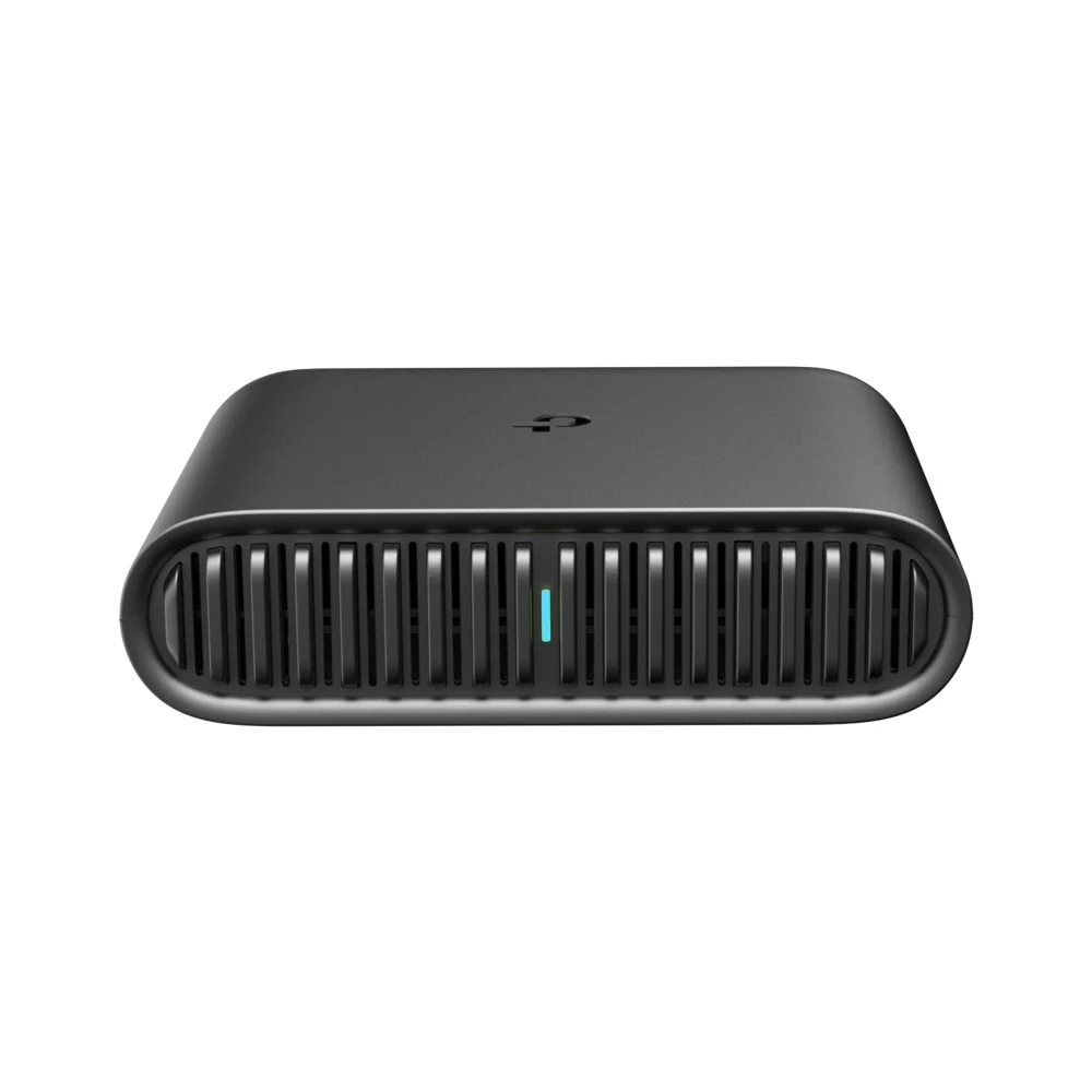 Black TP-Link TL-WR1502X travel router with a ribbed front grille and a small teal status light